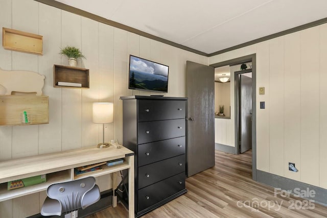 office featuring hardwood / wood-style flooring and ornamental molding