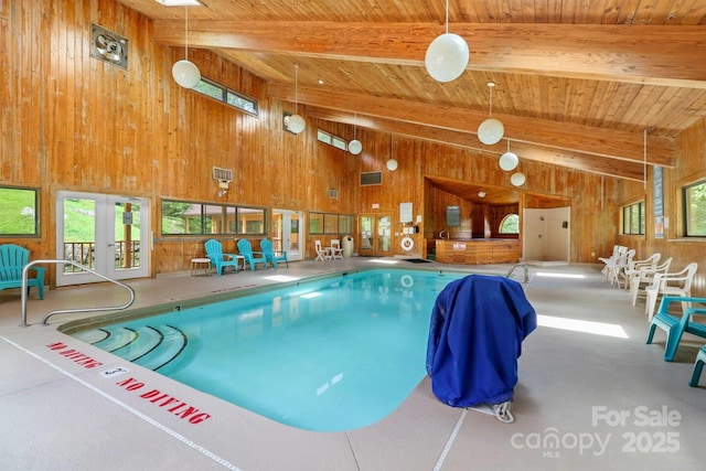 view of pool with french doors