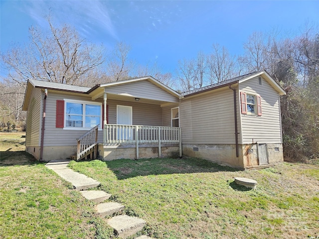 view of front of home with covered porch and a front yard