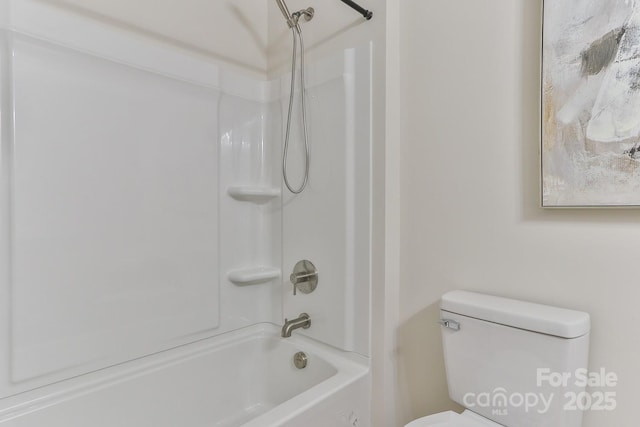 bathroom featuring toilet and shower / bathtub combination