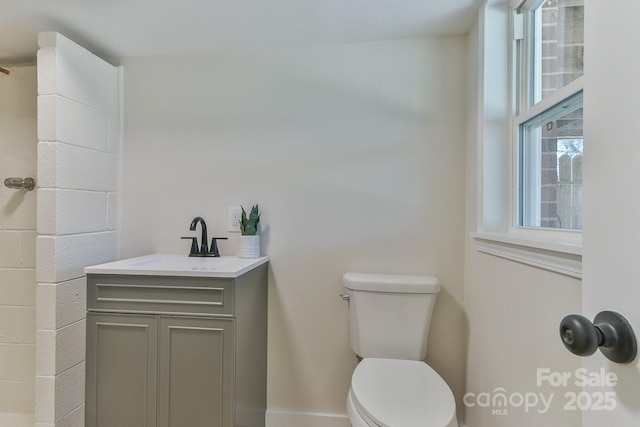 full bathroom featuring vanity and toilet