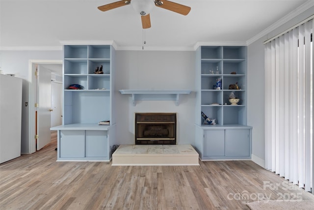 unfurnished living room with ceiling fan, light hardwood / wood-style flooring, and crown molding