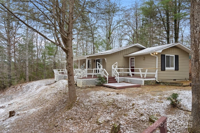 view of front of property with a wooden deck