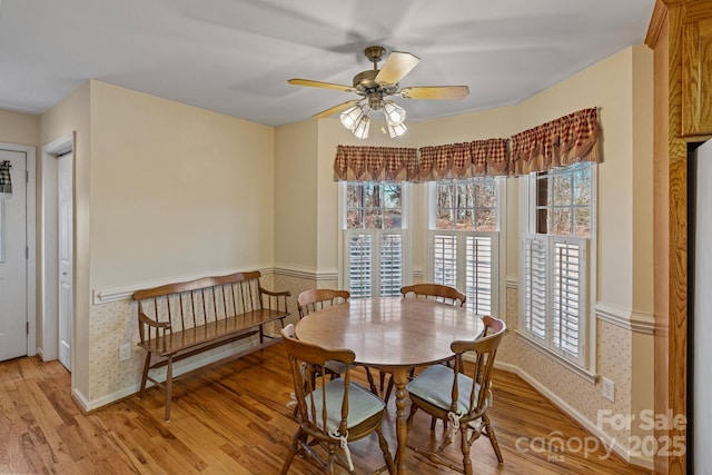 dining room featuring light hardwood / wood-style flooring, ceiling fan, and a wealth of natural light