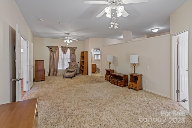 living area featuring light carpet and ceiling fan