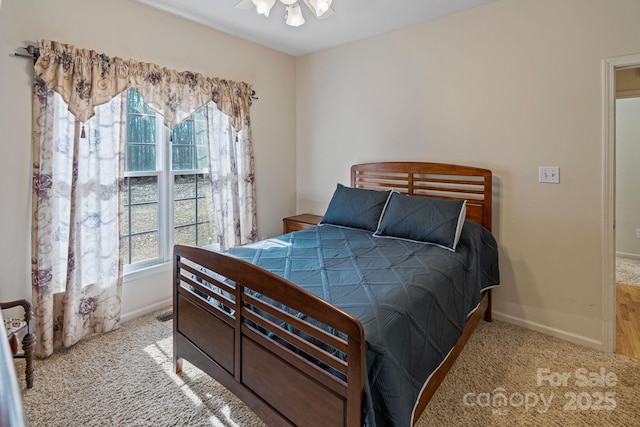 bedroom with light colored carpet