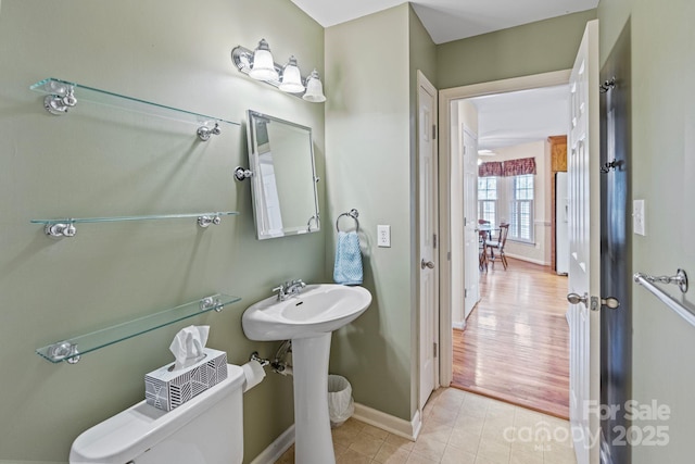 bathroom with tile patterned floors, toilet, and sink