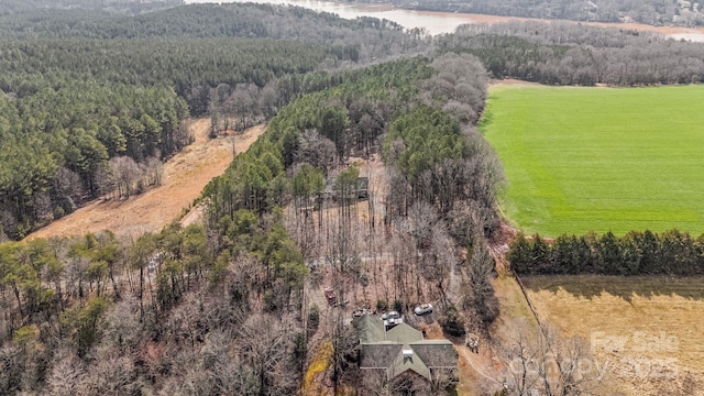 birds eye view of property with a rural view and a water view