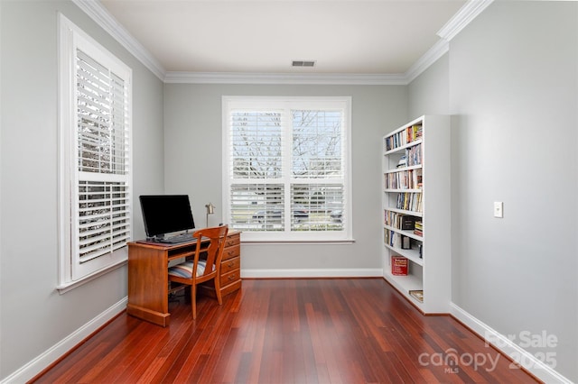 home office with crown molding, dark wood-style flooring, visible vents, and baseboards