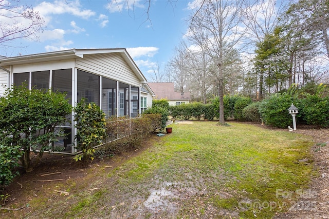 view of yard featuring a sunroom