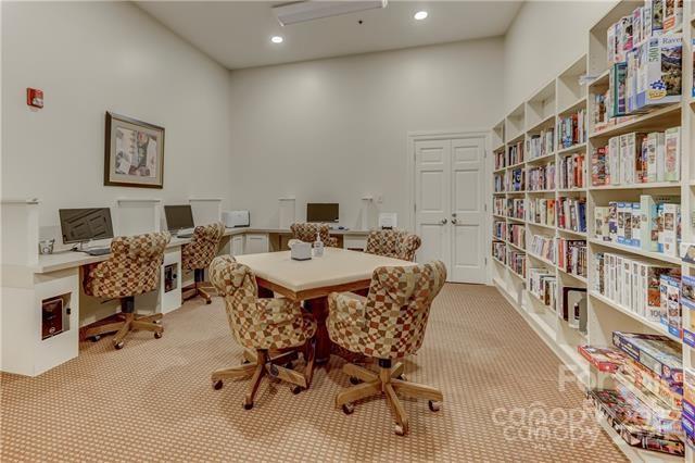 dining area featuring recessed lighting and light colored carpet