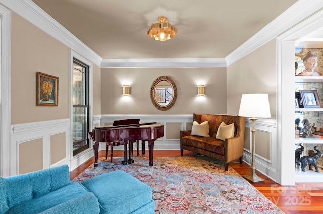 living area featuring ornamental molding and hardwood / wood-style flooring