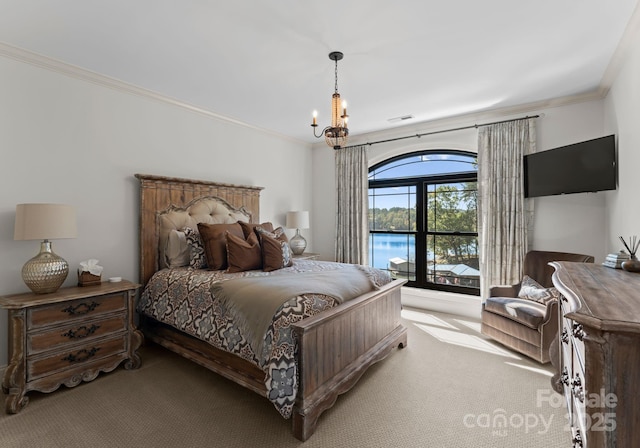 carpeted bedroom with ornamental molding and a notable chandelier