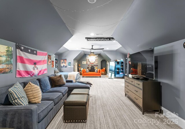 interior space featuring ceiling fan and lofted ceiling