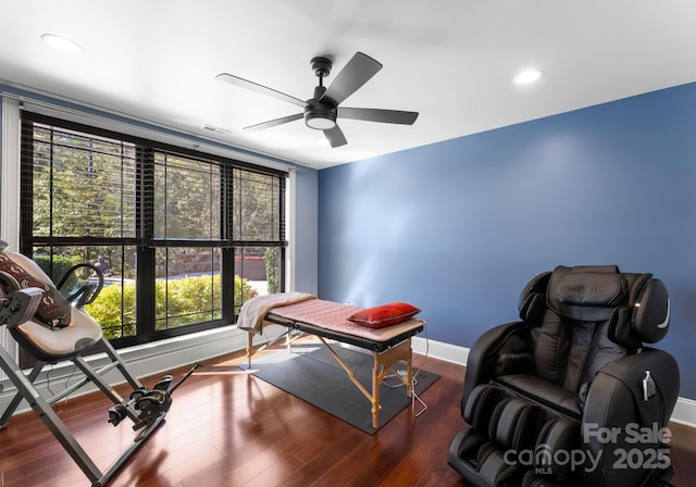 home office featuring ceiling fan and dark hardwood / wood-style floors