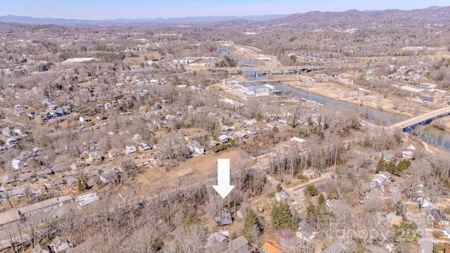 aerial view featuring a water and mountain view