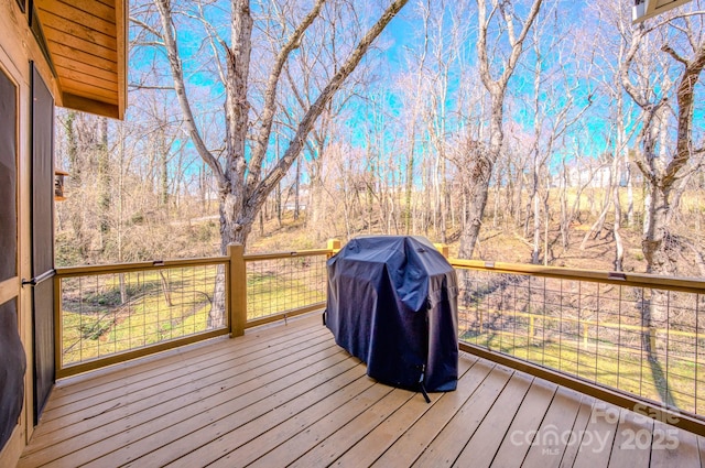 wooden deck with grilling area