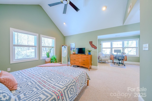 carpeted bedroom featuring high vaulted ceiling, ceiling fan, and baseboards