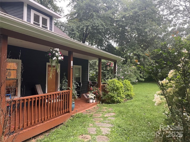 view of yard featuring covered porch