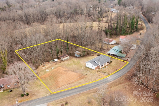 birds eye view of property featuring a rural view