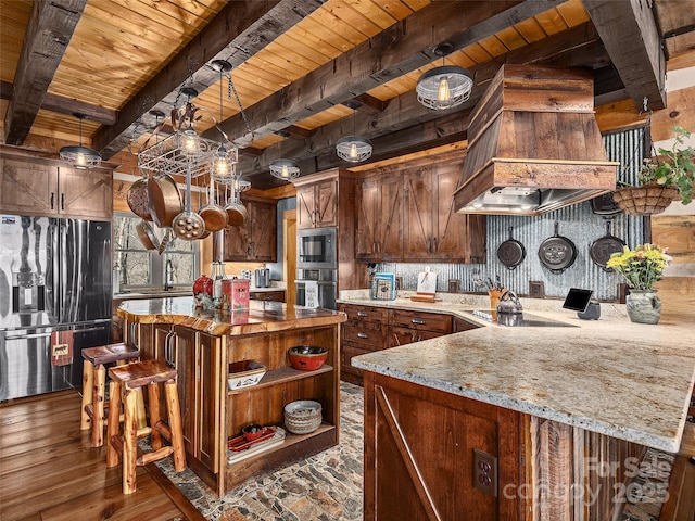 kitchen with black electric stovetop, wall oven, fridge with ice dispenser, hardwood / wood-style floors, and stainless steel microwave