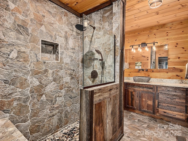 full bath with wooden ceiling, visible vents, vanity, a marble finish shower, and stone finish floor