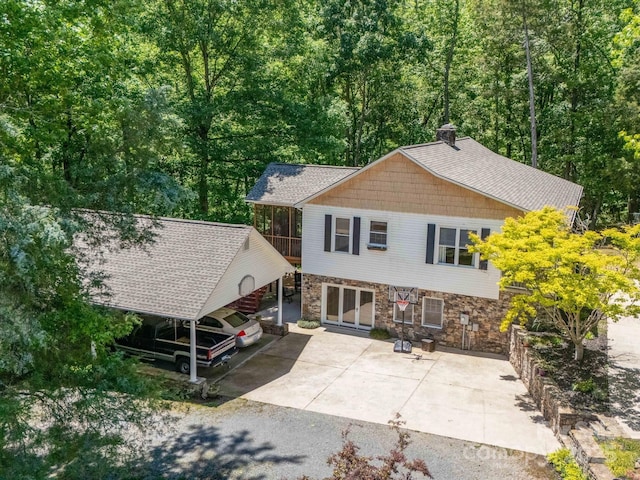 2988 Parks Lafferty Rd, Concord, NC 28025 - back of house with stone siding and a chimney
