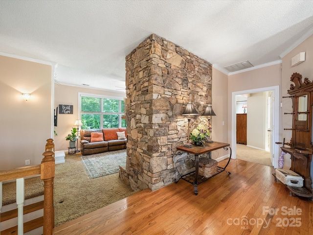 2988 Parks Lafferty Rd, Concord, NC 28025 - living area with ornamental molding, wood finished floors, a textured ceiling, and baseboards