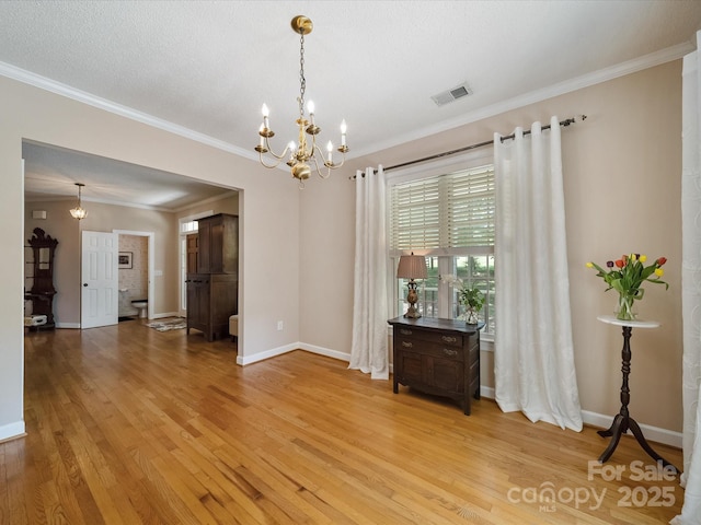 2988 Parks Lafferty Rd, Concord, NC 28025 - spare room featuring a chandelier, light wood-type flooring, crown molding, and baseboards