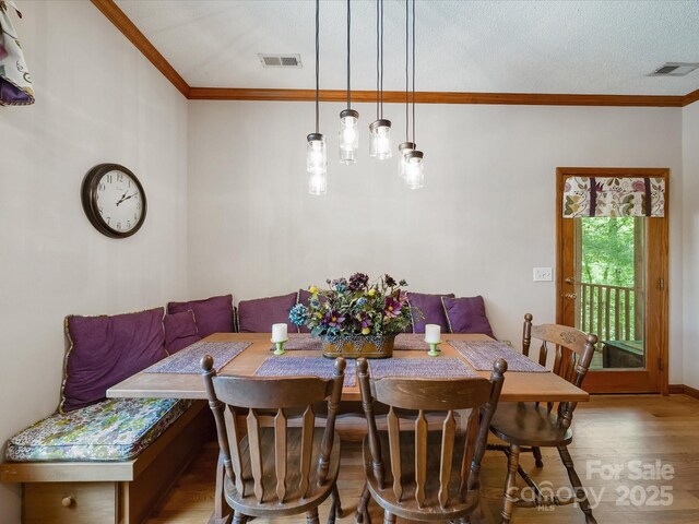 2988 Parks Lafferty Rd, Concord, NC 28025 - dining area featuring ornamental molding, wood finished floors, and breakfast area
