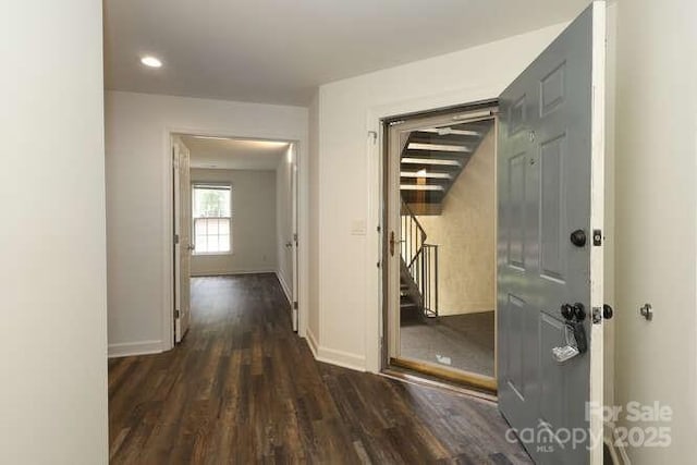 corridor featuring dark hardwood / wood-style flooring