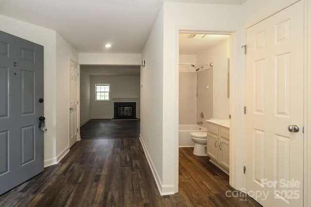 hall with dark hardwood / wood-style flooring