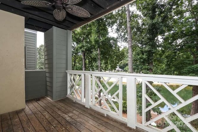 wooden terrace featuring ceiling fan