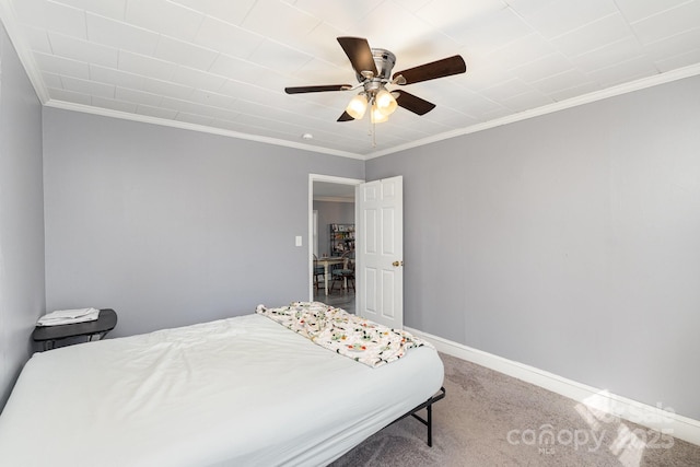 bedroom with carpet, ornamental molding, and ceiling fan