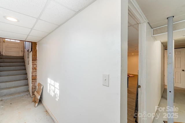 interior space featuring a drop ceiling