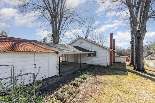 view of home's exterior with a lawn