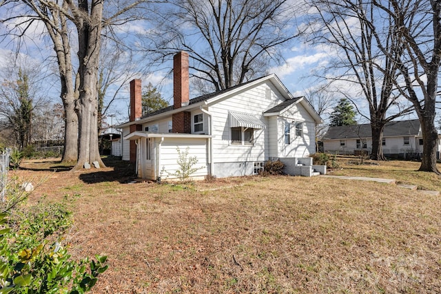 view of property exterior featuring a yard