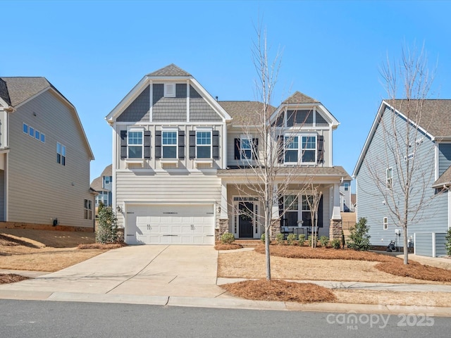 craftsman-style home featuring concrete driveway, covered porch, and a garage