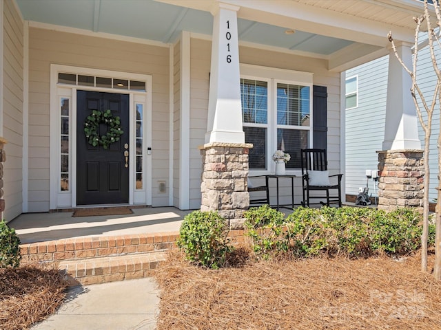 doorway to property with covered porch