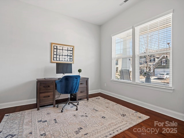 office featuring visible vents, wood finished floors, and baseboards