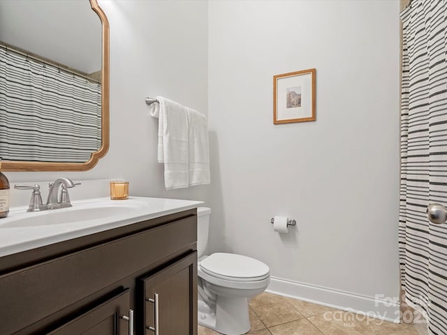 full bath featuring toilet, a shower with shower curtain, tile patterned flooring, baseboards, and vanity