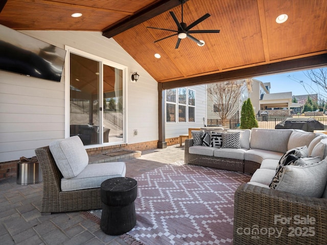 view of patio featuring an outdoor hangout area, a ceiling fan, and fence