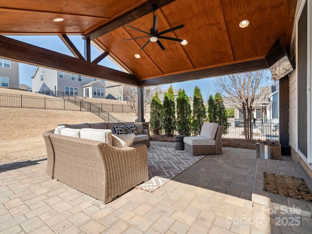 view of patio with an outdoor living space, a fenced backyard, a gazebo, and ceiling fan