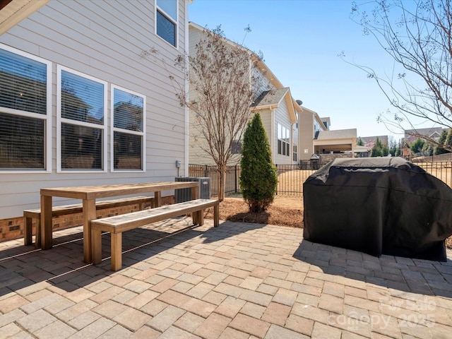 view of patio featuring grilling area, central AC, and fence