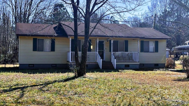 view of front of property featuring covered porch, crawl space, and a front yard