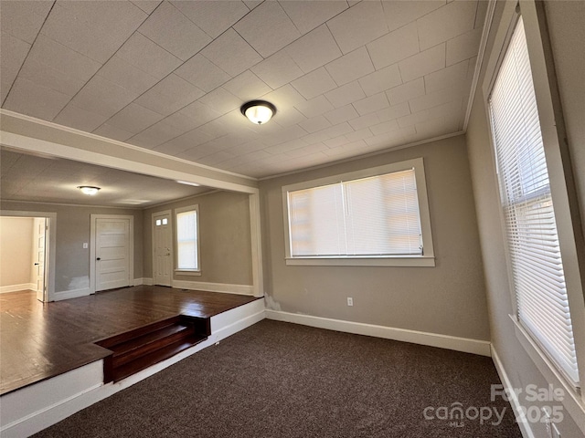 carpeted spare room with ornamental molding