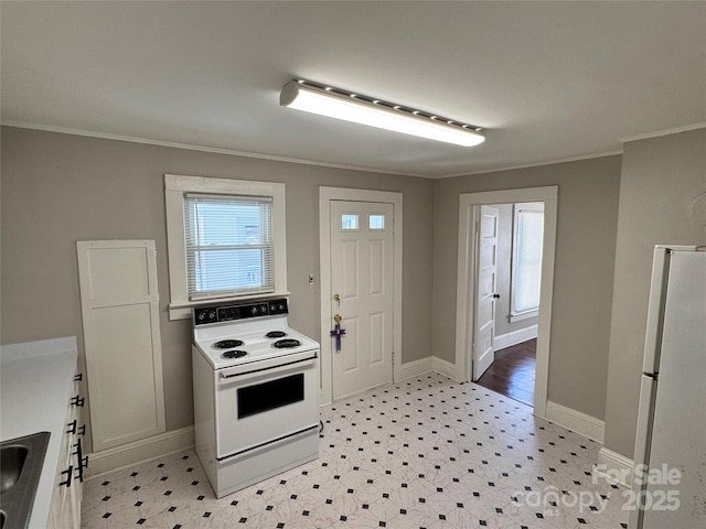 kitchen featuring white cabinetry, white appliances, ornamental molding, and sink