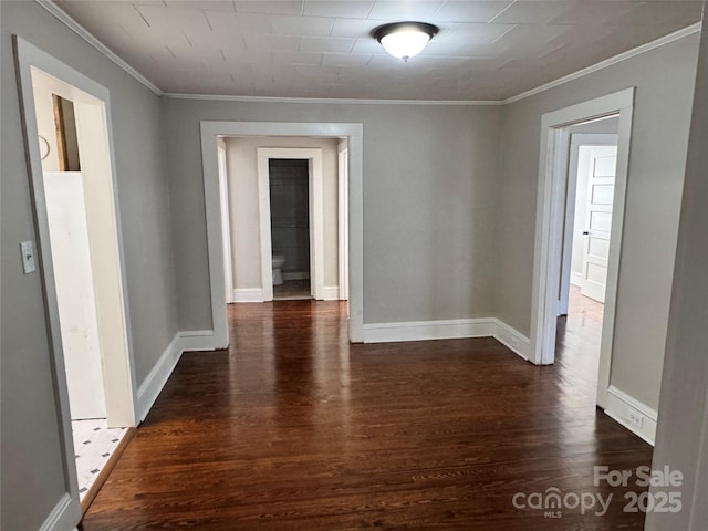 interior space with dark wood-type flooring and crown molding