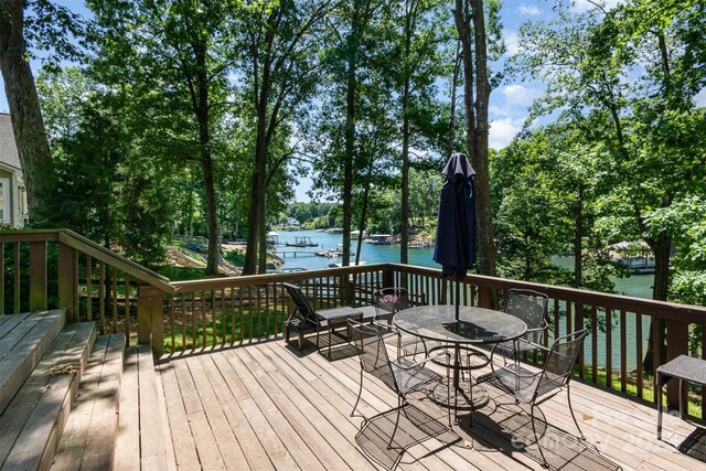 353 Whippoorwill Rd, Mooresville, NC 28117 - deck featuring a water view, outdoor dining area, and view of scattered trees