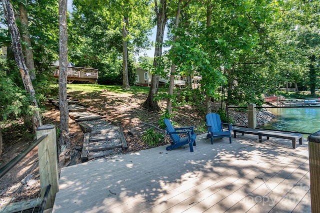 353 Whippoorwill Rd, Mooresville, NC 28117 - wooden terrace with view of wooded area and a water view